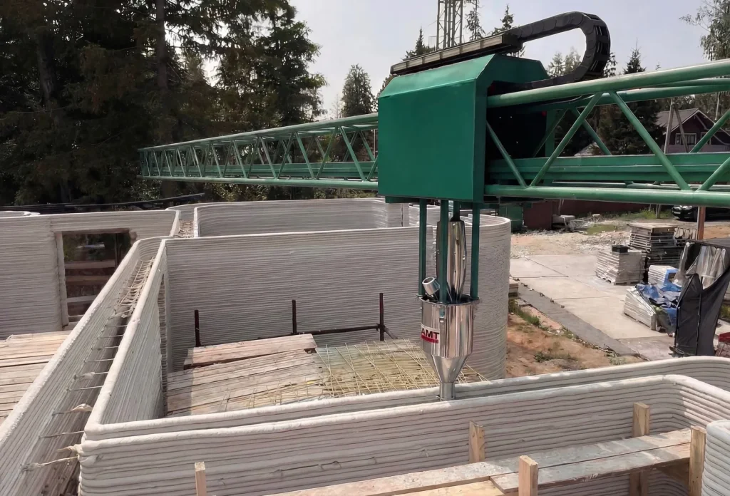 AMTG G4 print head depositing cement-based material along curved walls