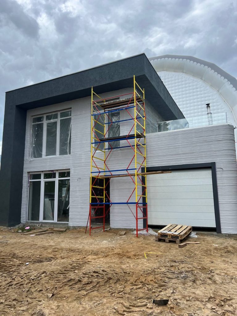 Customer-built two-story residence using construction 3D printing